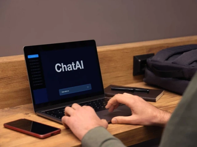 hands typing on a keyboard while the computer screen reads "chatAI"