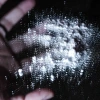 White opioid powder on glass