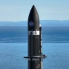 The payload nose cone is pictured against the ocean backdrop at Rocket Lab's launch site in New Zealand