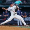 Tony Pluta stepping off the mound during a baseball pitch